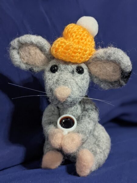 A cute mouse cozy with a cuppa